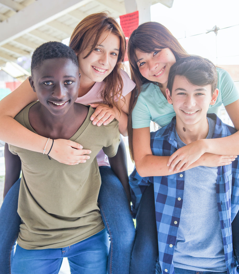 Group of teens, posing at school